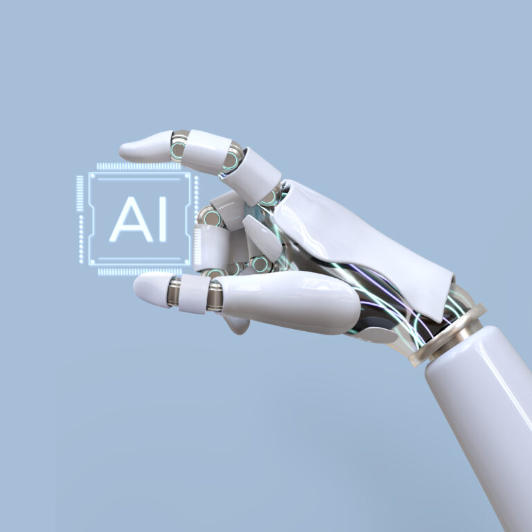 Robotic hand holding an "AI" chip